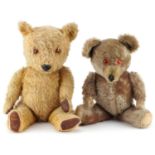 Two early 20th century straw filled teddy bears with jointed limbs including a golden example with