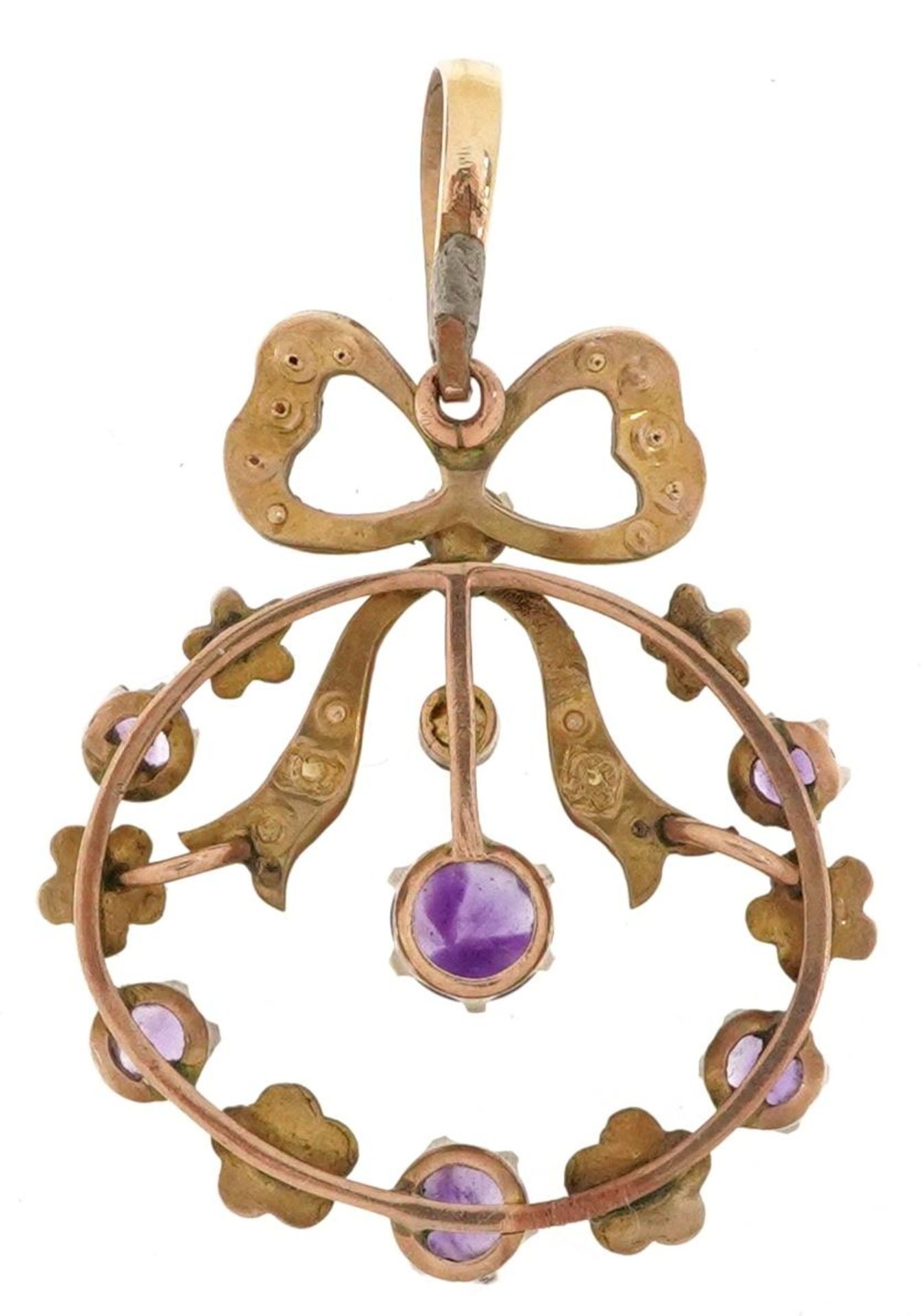 Edwardian unmarked gold amethyst and seed pearl openwork bow design pendant, tests as 9ct gold, with - Bild 2 aus 3