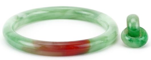 Chinese green jade bangle and pendant with unmarked gold mount, the bangle 8cm in diameter, total