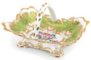 19th century Staffordshire green ground porcelain basket hand painted with flowers, 22cm wide