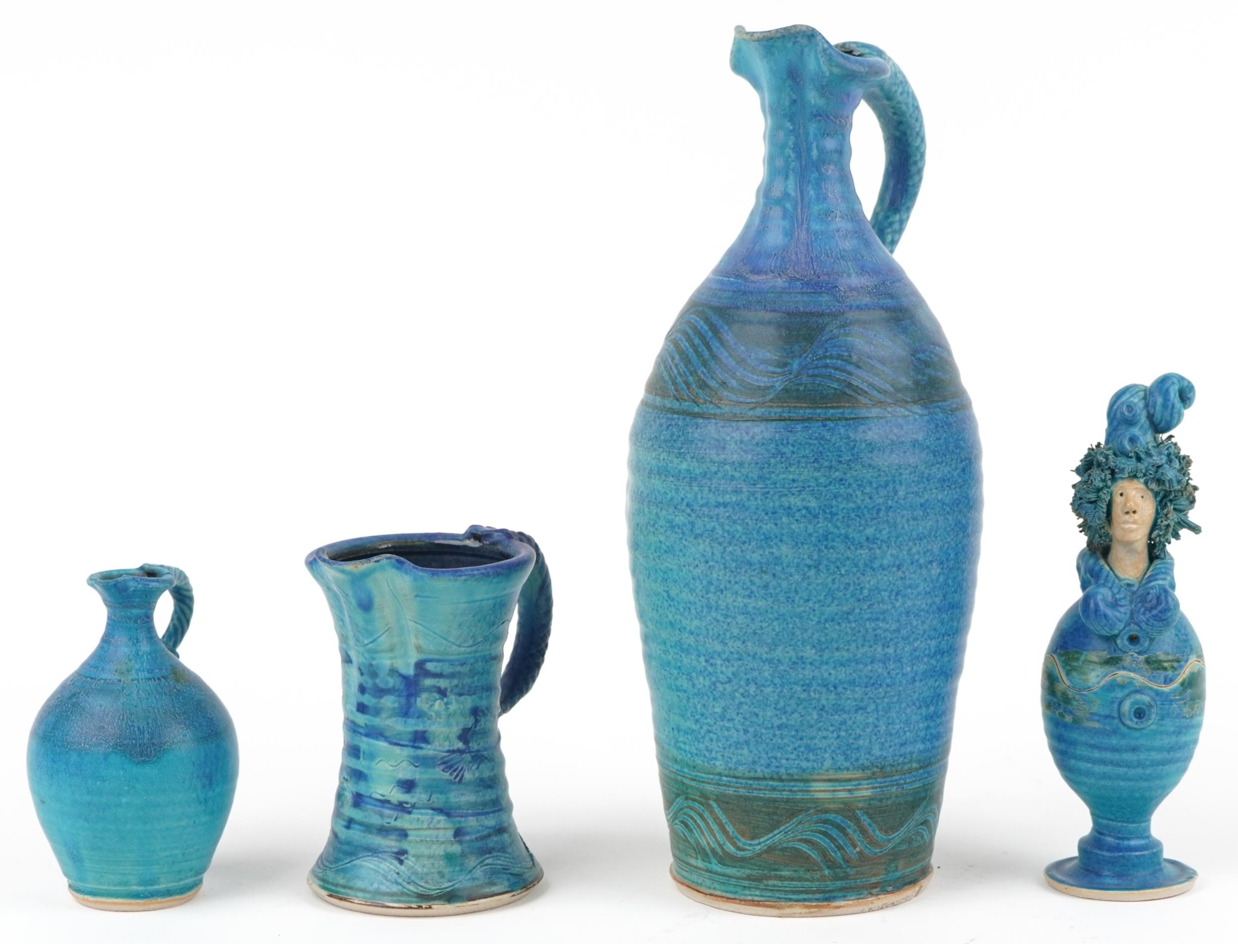 Michael Kennedy, Irish blue glazed studio pottery comprising three jugs and a figural pot and cover,