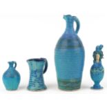 Michael Kennedy, Irish blue glazed studio pottery comprising three jugs and a figural pot and cover,