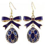 Pair of silver gilt blue enamel and garnet drop earrings in the form of bows with eggs, each set