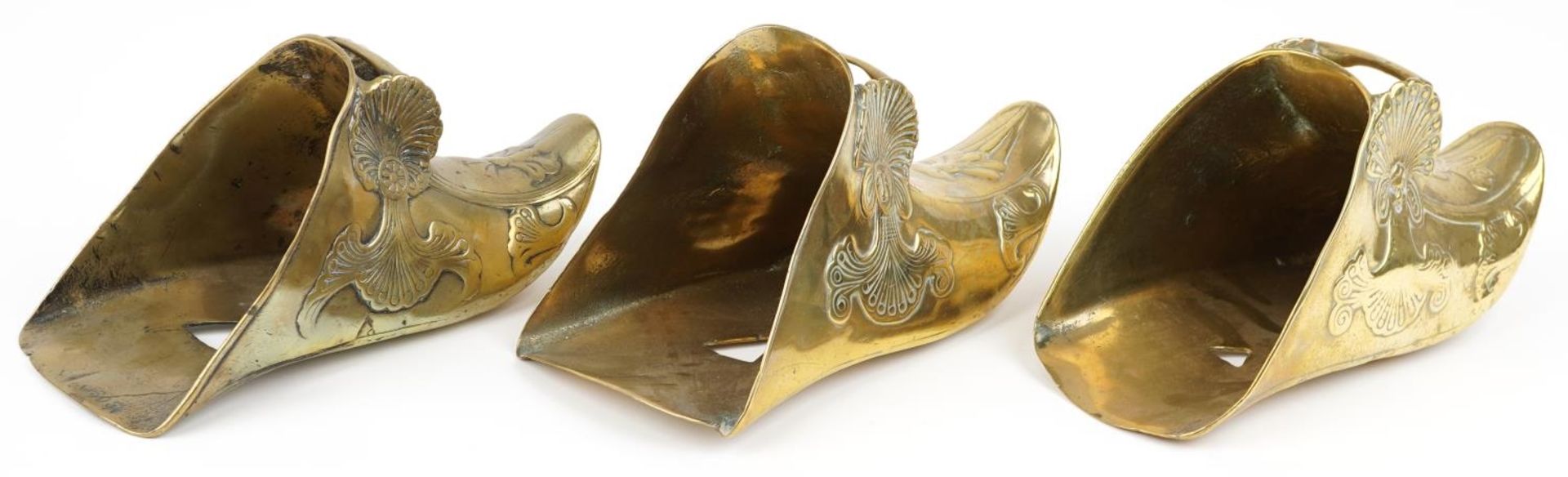 Three 19th century Spanish Conquistador brass stirrups with foliate decoration including a pair, - Image 2 of 4