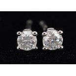 Pair of 9ct white gold diamond solitaire stud earrings with certificate, total diamond weight