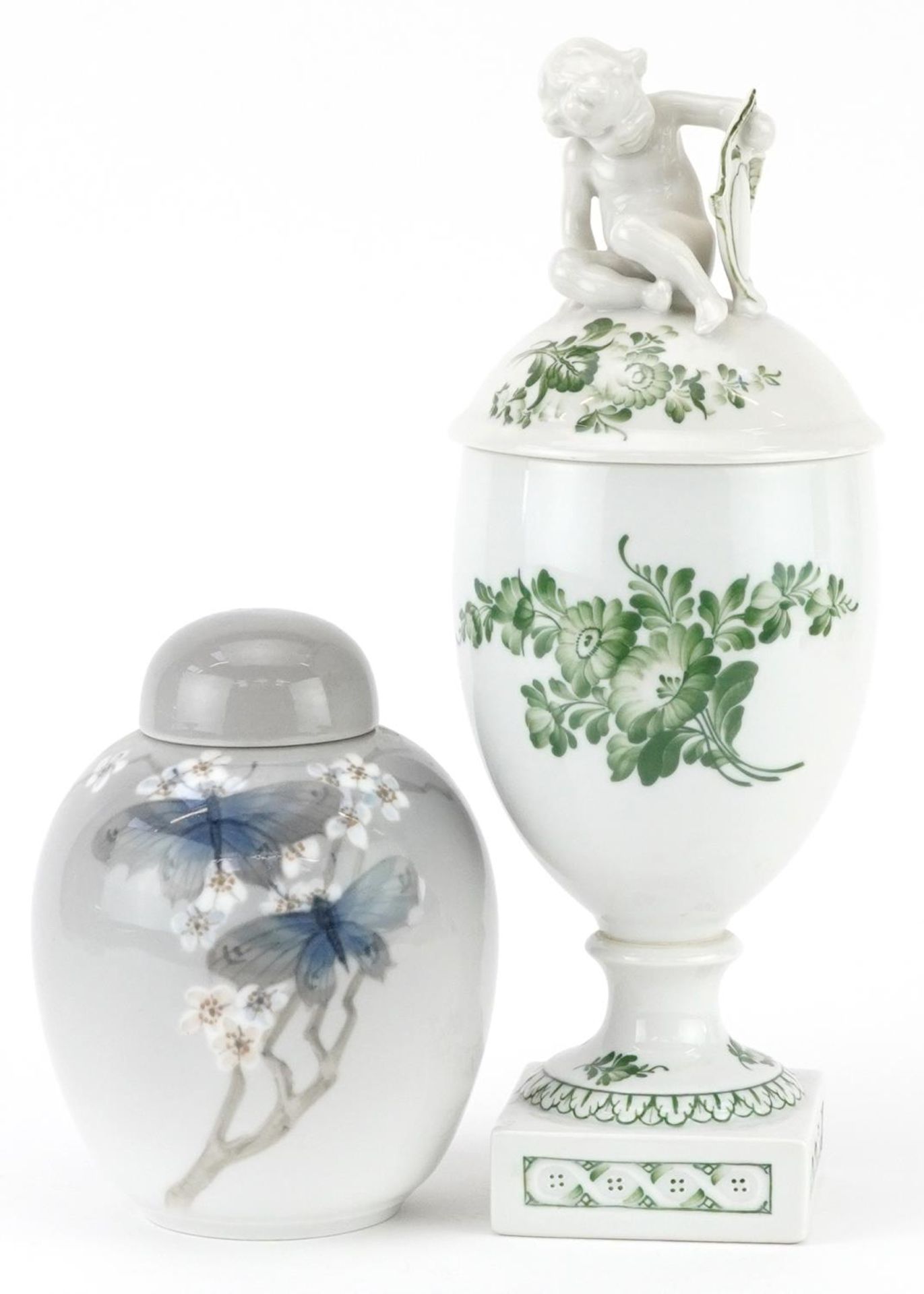 Royal Copenhagen, Danish porcelain comprising a vase and cover surmounted with Putti and a jar and