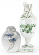 Royal Copenhagen, Danish porcelain comprising a vase and cover surmounted with Putti and a jar and