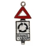18ct white gold and enamel charm in the form of a roundabout traffic road sign, 1.6cm high, 0.9g