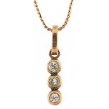 9ct gold diamond three stone pendant on a 9ct gold necklace, total diamond weight approximately 0.21