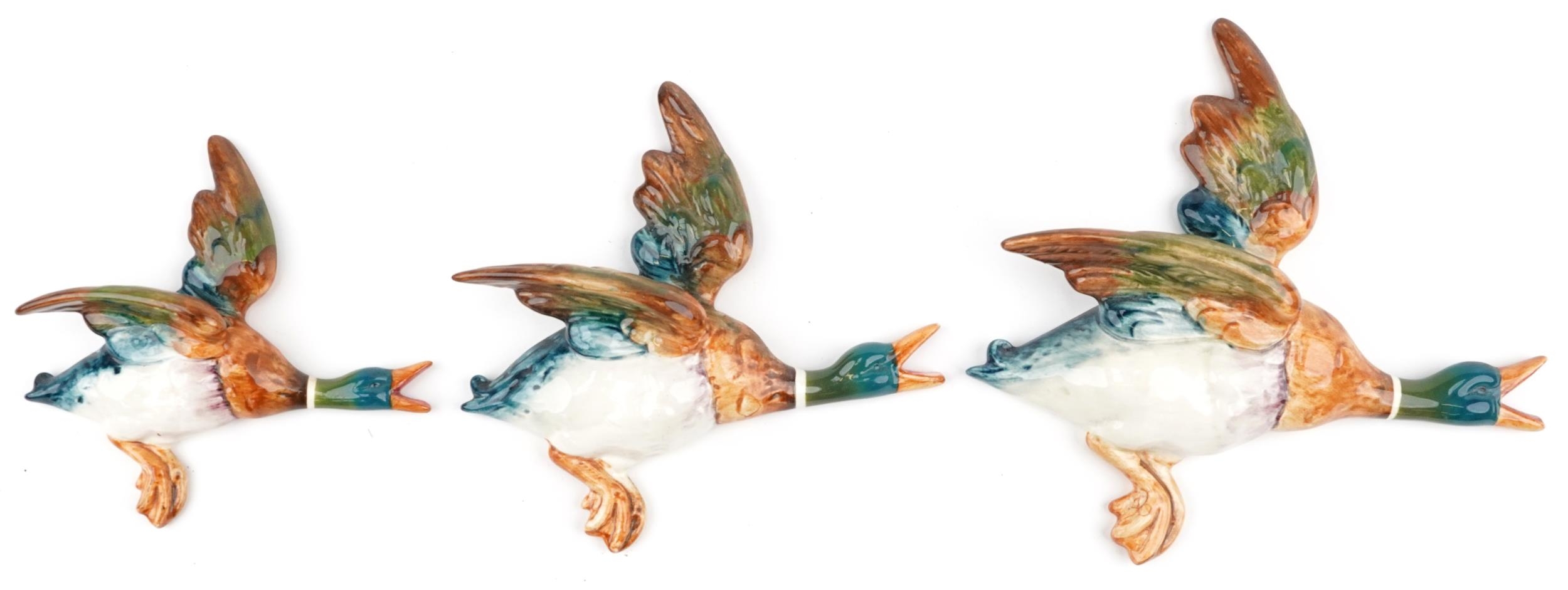 Graduated set of three Beswick Mallard wall plaques numbered 596-1, 596-2 and 596-3, the largest