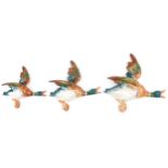 Graduated set of three Beswick Mallard wall plaques numbered 596-1, 596-2 and 596-3, the largest