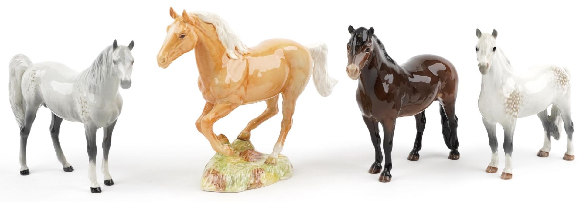 Four Beswick collectable horses including a galloping Palomino numbered 1374, Welsh Mountain pony