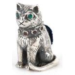 Sterling silver pincushion in the form of a seated cat set with emerald eyes and garnet collar, 2.
