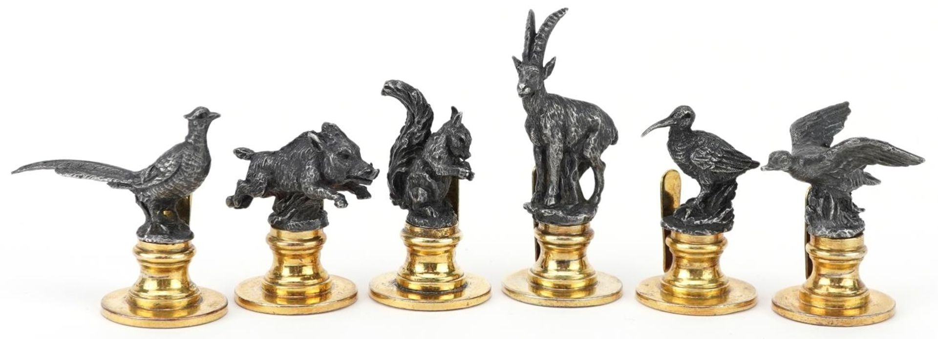 Gucci, set of six Italian silver and silver gilt menu/name place card holders in the form of game