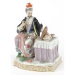 Meissen, 19th century German porcelain figure of a female sitting beside a dressing table with