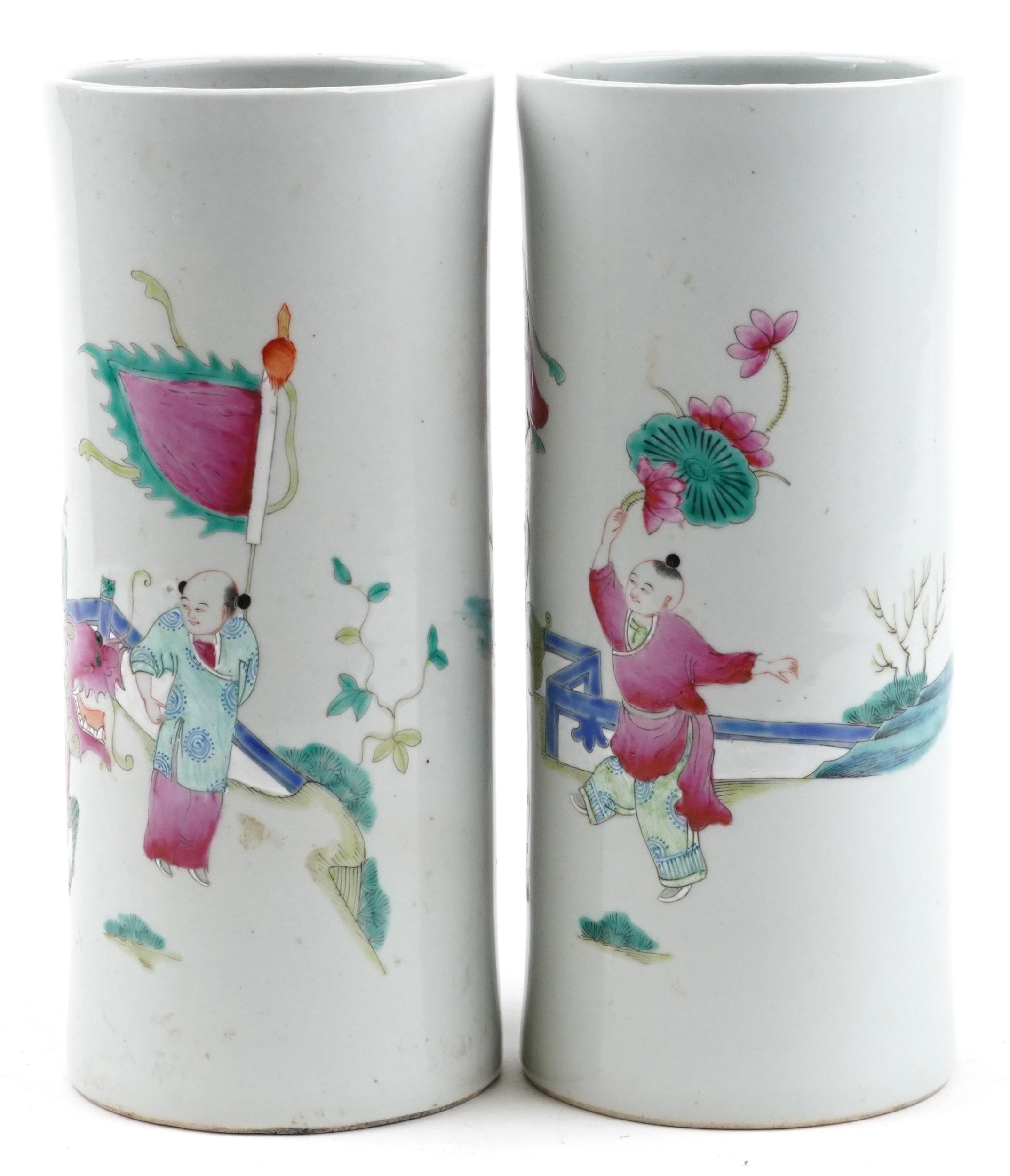 Pair of Chinese porcelain cylindrical vases hand painted in the famille rose palette with a family - Image 2 of 6