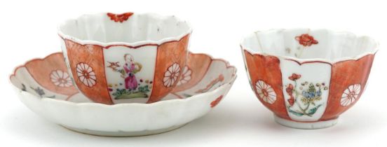 Chinese famille rose porcelain comprising two tea bowls and a saucer, each hand painted with figures