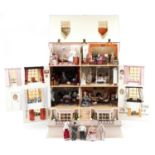 Large hand painted, hand made Georgian style wooden doll's house with electrics housing a collection