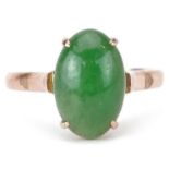 Chinese 14K gold cabochon green jade ring housed in a J Perry Nottingham jeweller's box, the jade