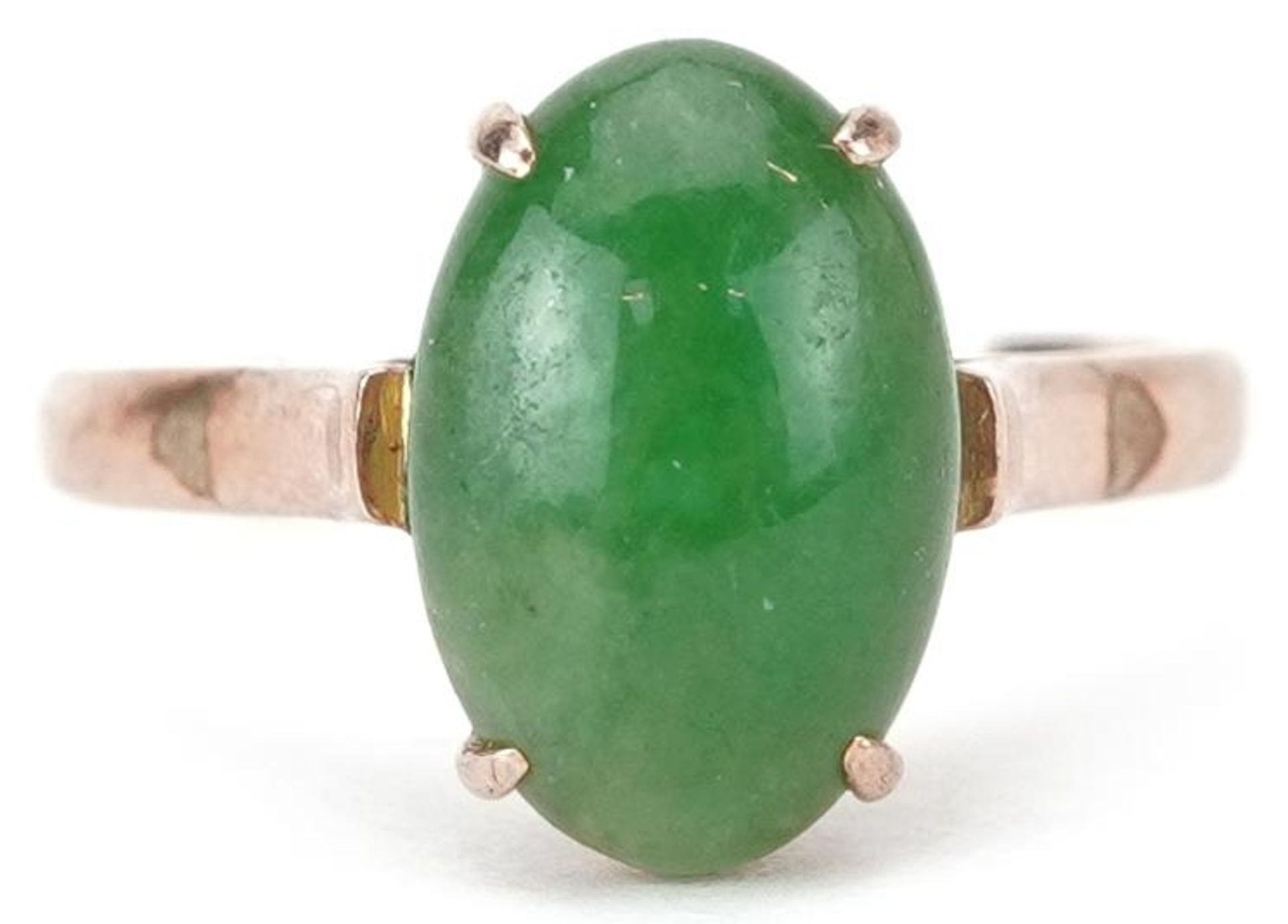 Chinese 14K gold cabochon green jade ring housed in a J Perry Nottingham jeweller's box, the jade