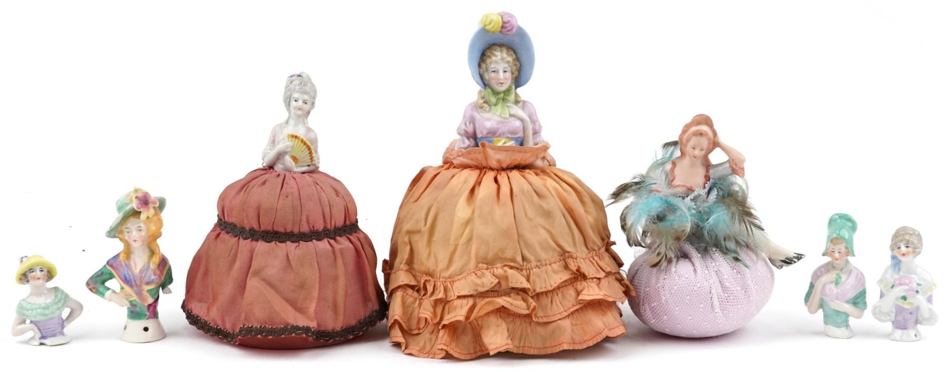 19th century and later half pin dolls including three pin cushions, the largest 21cm high