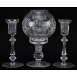 Three cut glass candlesticks comprising one with globular shade and a pair of Curraghmore examples