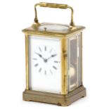 Large French brass cased repeating carriage clock striking on a gong with enamelled dial having