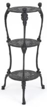 Victorian style cast iron three tier plant stand with figural mounts, 74cm high