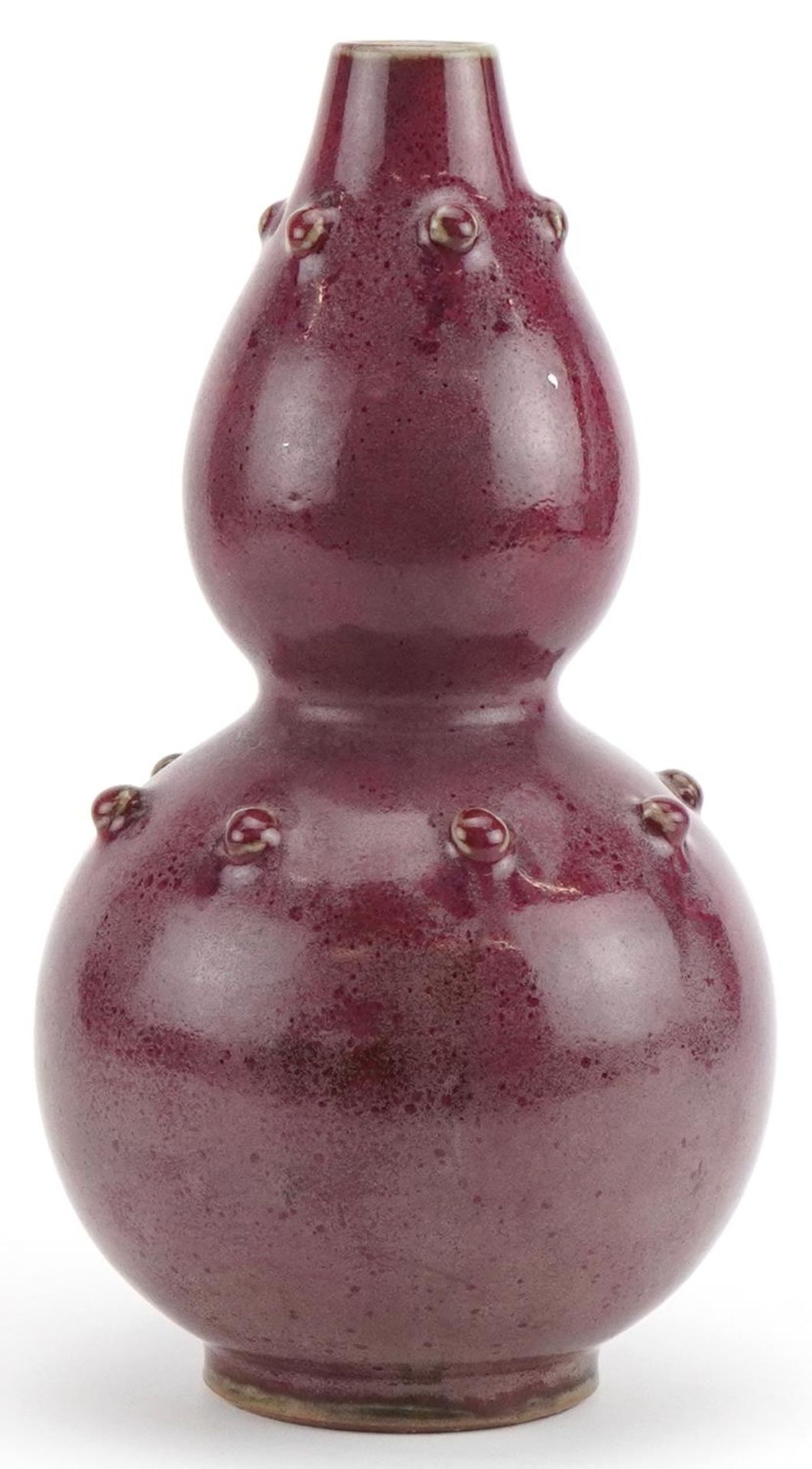 Chinese porcelain double gourd vase having a red glaze, 25cm high