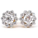 Pair of 18ct gold diamond cluster stud earrings with certificate, total diamond weight approximately