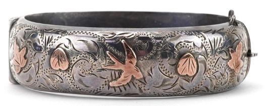 Victorian style silver and gold floral engraved hinged bangle housed in a W Hinds Brighton jewellers