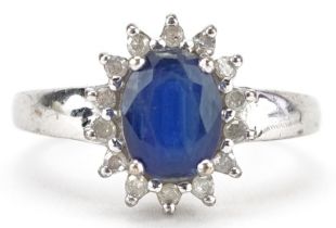 9ct white gold blue spinel and diamond cluster ring, the spinel approximately 8.0mm x 6.0mm x 3.65mm