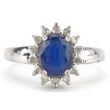 9ct white gold blue spinel and diamond cluster ring, the spinel approximately 8.0mm x 6.0mm x 3.65mm