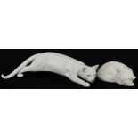Royal Copenhagen, two Danish porcelain cats including a Stalking Cat by C F Liisberg, the largest