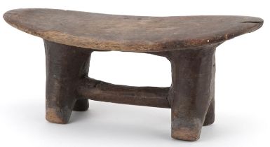 African tribal interest carved hardwood headrest, 30cm wide