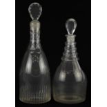Two Georgian cut glass decanters including one engraved with flowers, the largest 32cm high