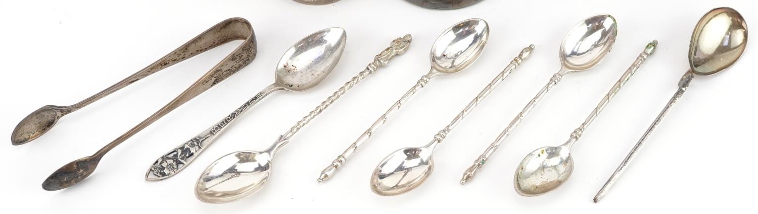 Silver objects comprising seven teaspoons, napkin ring, sugar tongs and bud vase, the largest 19.5cm - Image 3 of 8