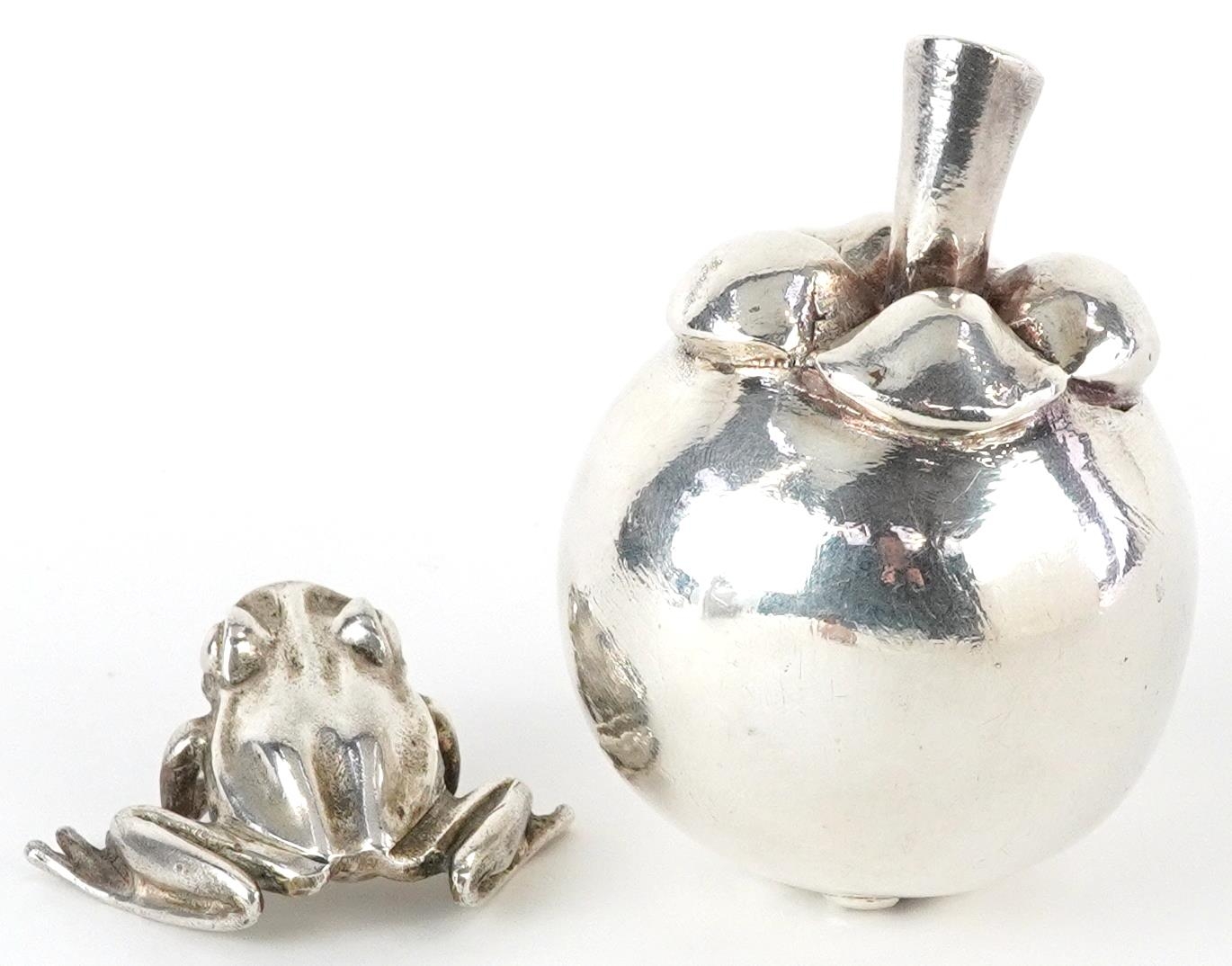 Silver model of a seated frog and a silver filled model of a pome fruit, the largest 7.5cm high, - Image 2 of 5