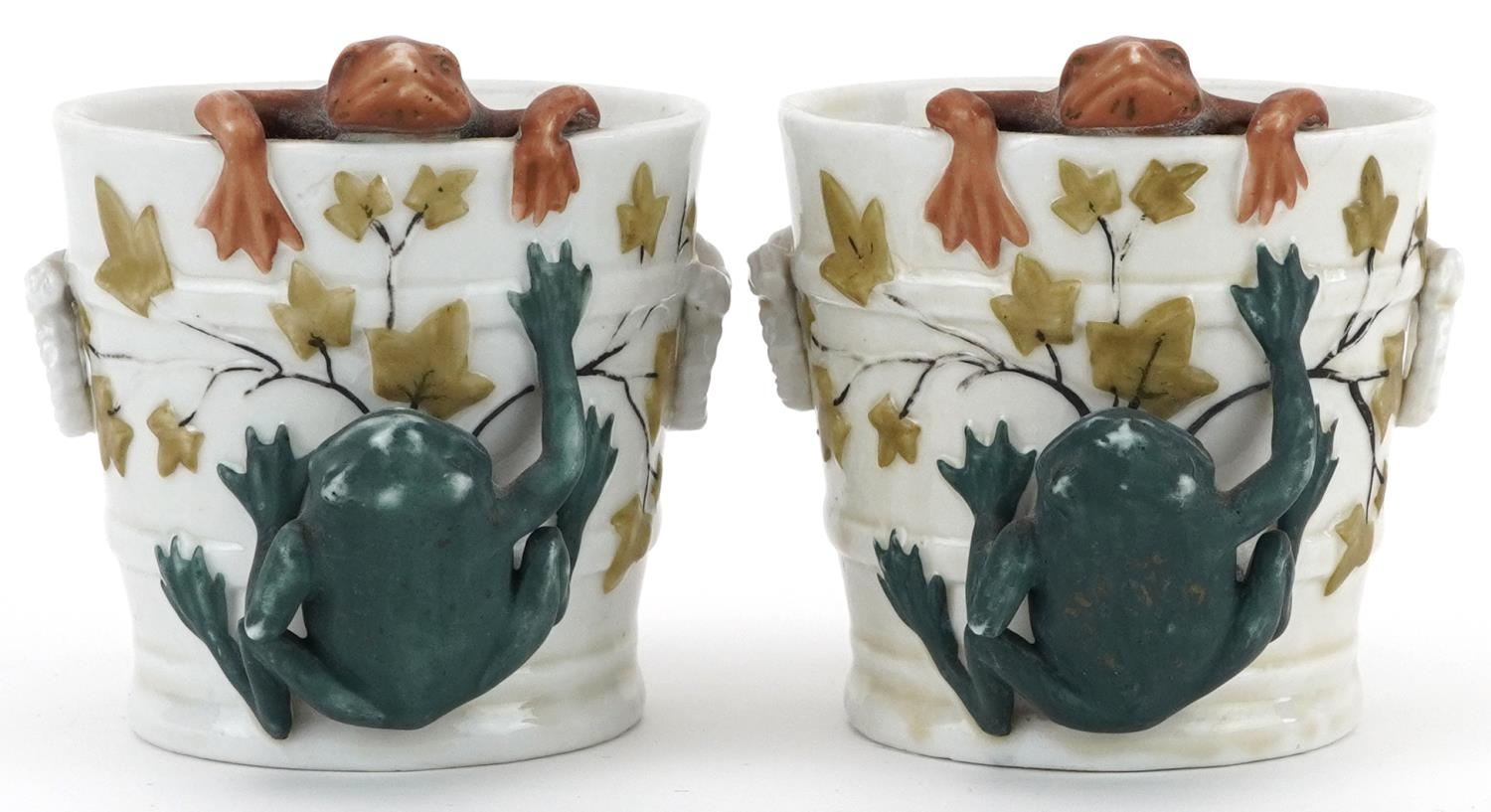 Pair of 19th century continental porcelain comical cache pots in the form of buckets mounted with