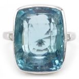 Art Deco style 18ct white gold aquamarine ring with diamond set shoulders, the aquamarine