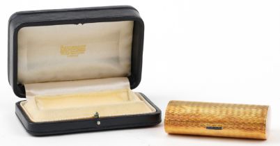 Boucheron, 18ct gold engine turned minaudière with sapphire set clasp, housed in a Boucheron