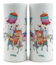 Pair of Chinese porcelain cylindrical vases hand painted in the famille rose palette with a family