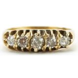 Unmarked gold graduated diamond five stone ring, total diamond weight approximately 0.25 carat, size