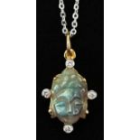 14ct gold diamond and carved labradorite pendant in the form of a Buddha head, on a silver necklace,