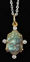 14ct gold diamond and carved labradorite pendant in the form of a Buddha head, on a silver necklace,