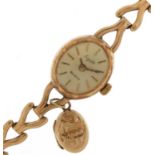 Everite, ladies 9ct gold wristwatch with 9ct gold strap and an unmarked gold locket, the case 15mm