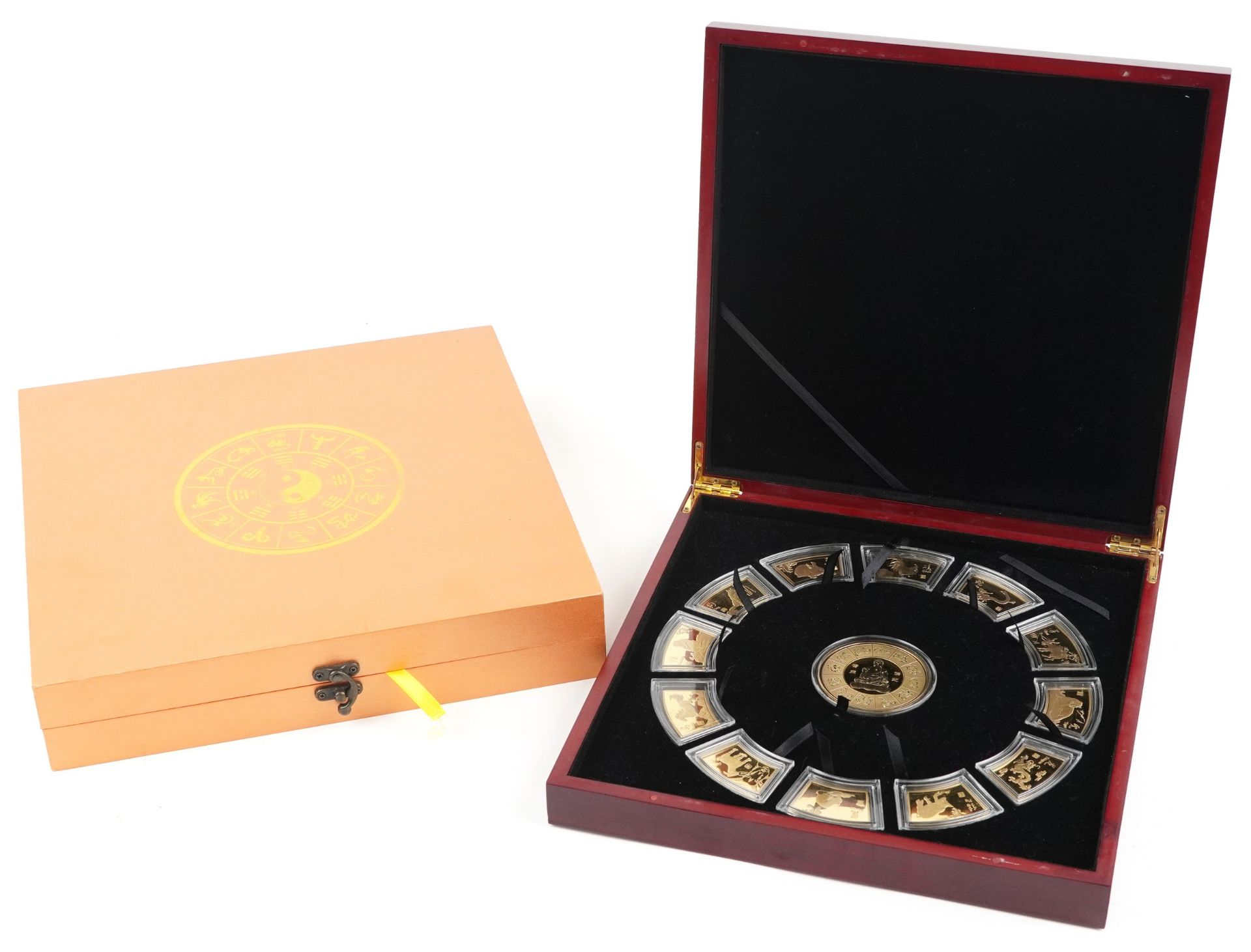 Set of Chinese zodiac ingots housed in a fitted box with protective box, 32cm x 32cm