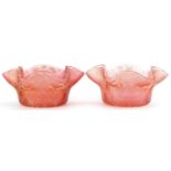 Pair of Art Nouveau iridescent peach glass finger bowls, each 14cm in diameter