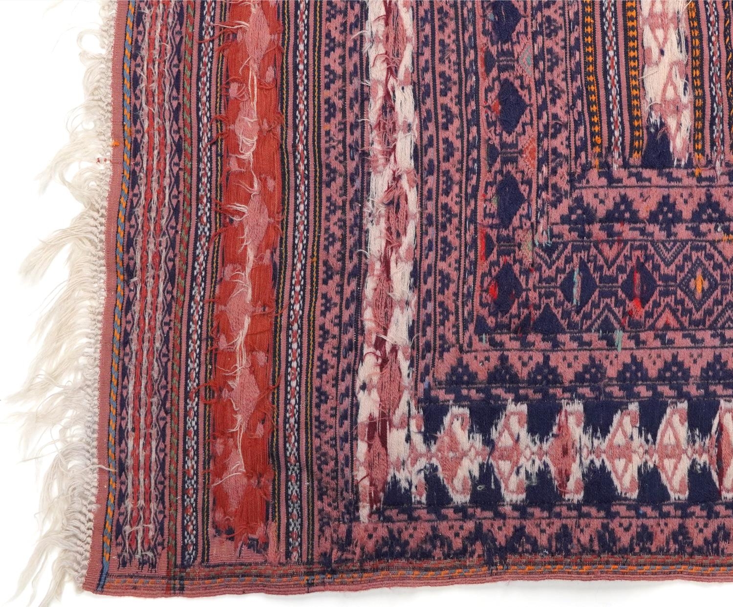 Rectangular Afghan red ground rug having an allover geometric design within corresponding borders, - Image 4 of 4