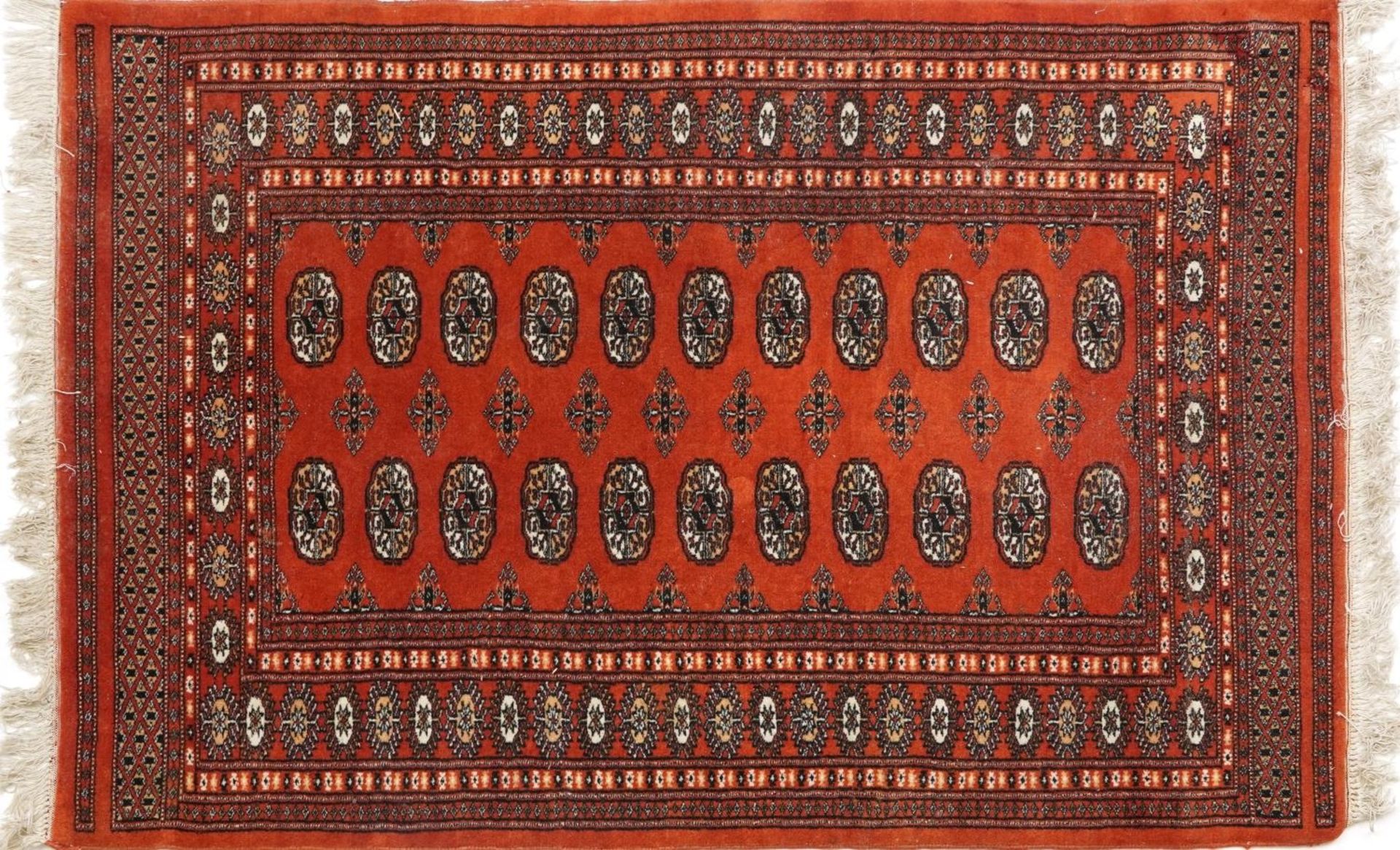 Rectangular Turkish Bokhara peach ground rug having an allover repeat flower head design, 150cm x - Bild 3 aus 4
